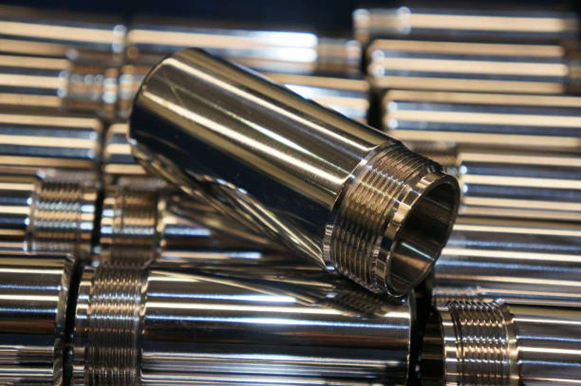 Machined metal parts with an even silver-grey electroless nickel finish