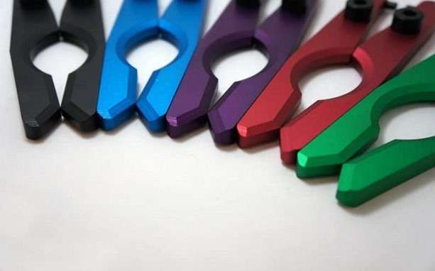 identical anodized aluminum components in different colors placed on the display