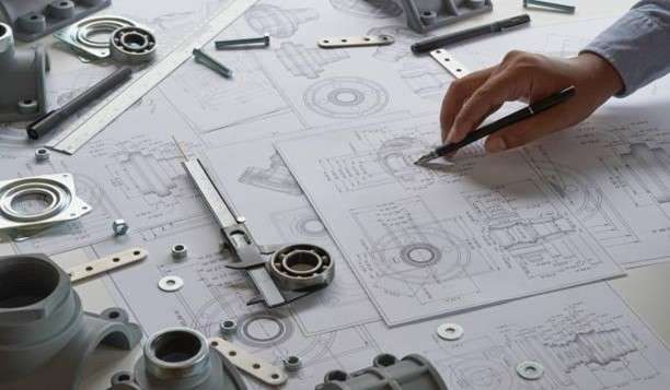 an industrial engineer analyzing technical drawings with caliper tools