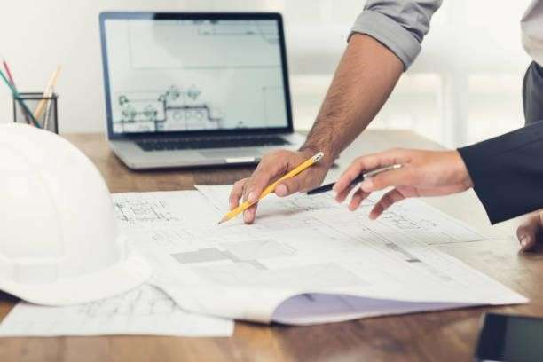 an engineer analyzing a technical drawing blueprint