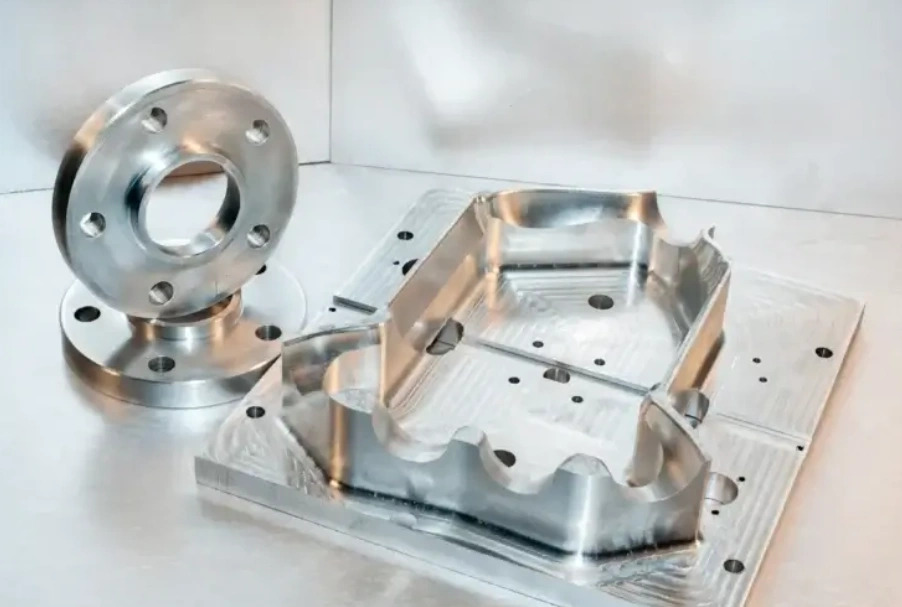 Two circular and one square metal brackets made by 3-axis CNC machining 