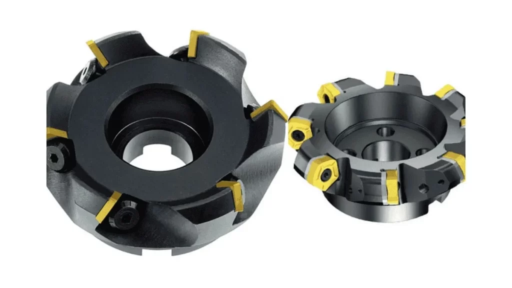 A pair of face mill tools with flat cutting surfaces, shown side by side.
