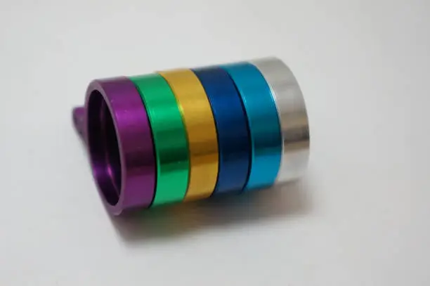 An abstract colorful spectrum representing thin-film interference, the optical phenomenon where light waves reflect off a transparent titanium oxide layer to create vibrant structural colors.