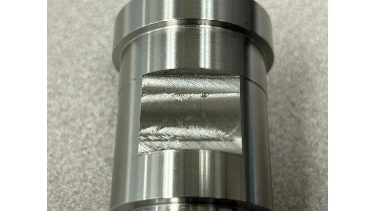 A close-up image showing a metal surface with visible chatter marks after machining.