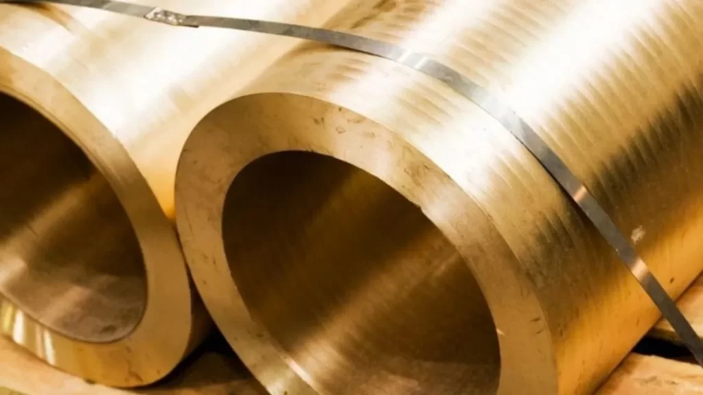 Brownish surface-hardened components secured with ropes for the surface hardening process.