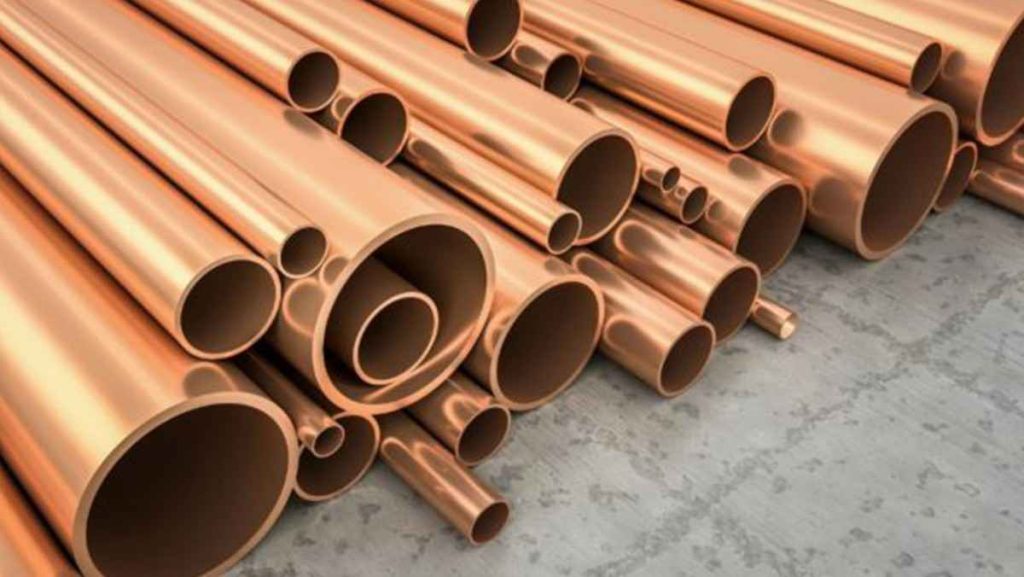 Stack of reddish-golden copper alloy pipes.
