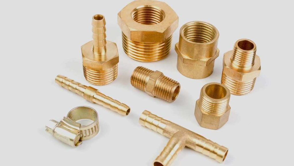 Collection of shiny golden brass pipe connectors.