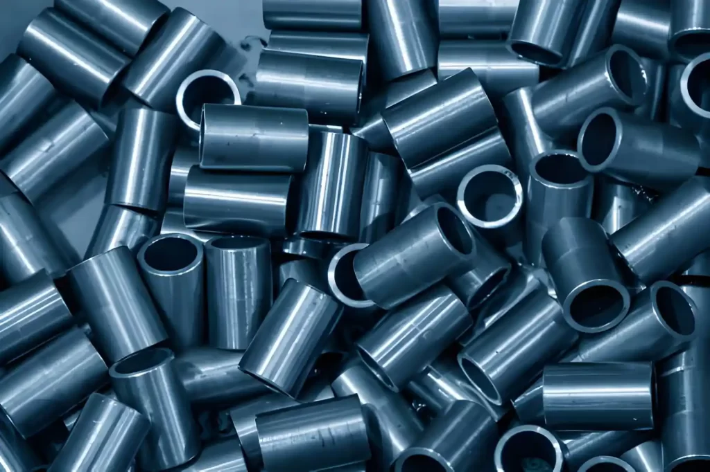The image shows metal components finished with trivalent zinc plating and blue passivation.