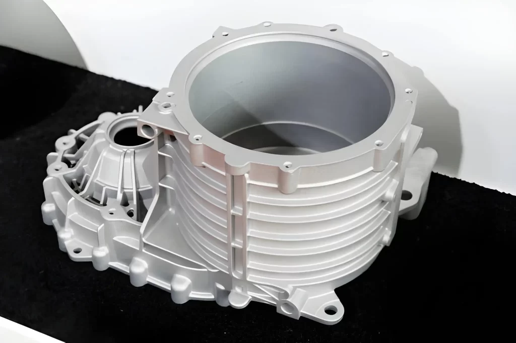 A close-up image of a die-cast automotive engine cover.
