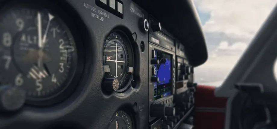 A detailed view of an aircraft cockpit dashboard featuring various injection-molded plastic trim panels and instrument housings.