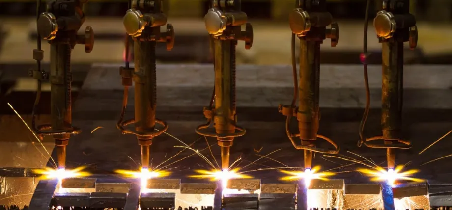 five laser cutter tools cutting metal sheet with sparks