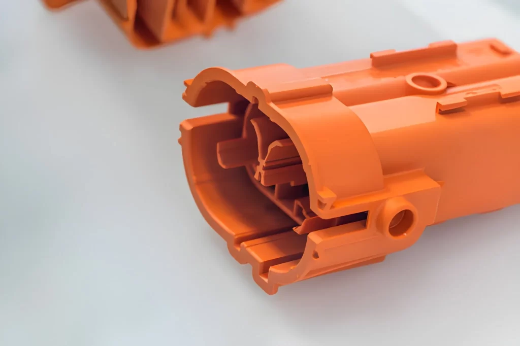 Plastic housing of a quick connect and release terminal connector, produced using injection molding, showing its snap-fit design.