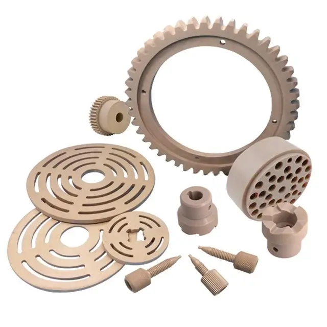 Precision-engineered PEEK plastic parts, including gears, discs, and fittings.