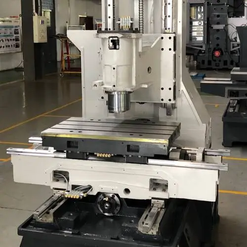 Close-up view of a 3 multi-axis CNC machine in an industrial setup