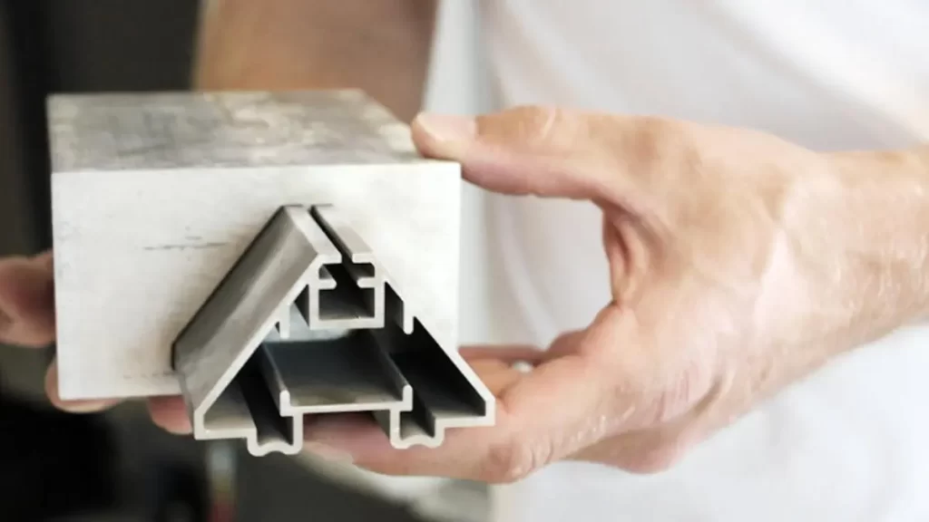 An mechanist showing extruded aluminum profile on the hand