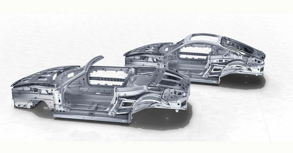 Two aluminum model car bodies made with die casting  side by side 