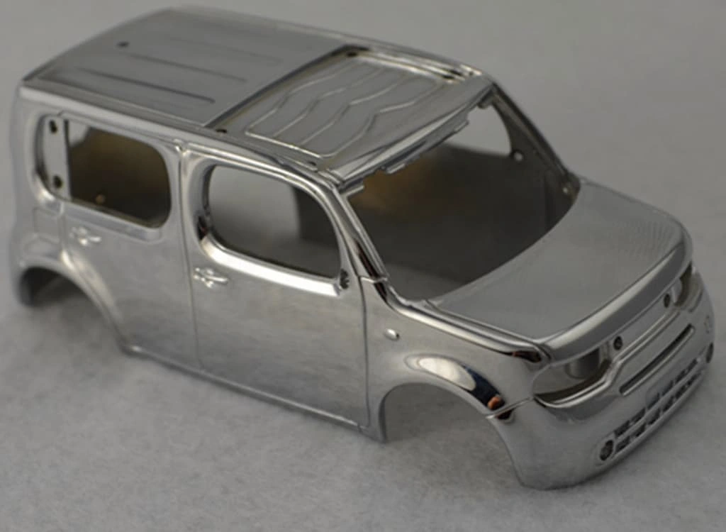 An Die-cast car body of an model car just after ejecting from the mold