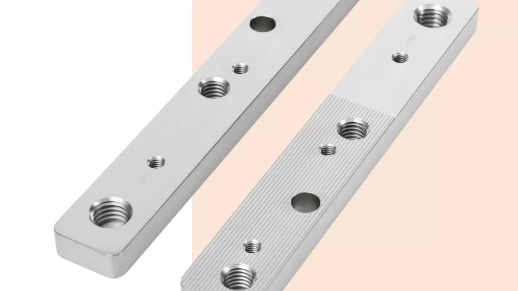 Parts with threaded holes having electroless plating, featuring a uniform, metal coating applied without electricity.