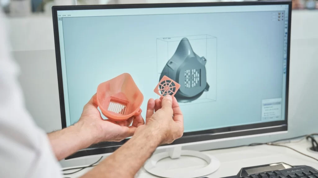 A CAD model displayed on a screen, representing the development process of a medical device prototype, showcasing detailed design elements.