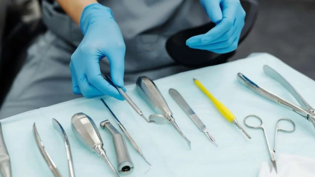 A set of surgical instruments and tools, including scalpels, forceps, and scissors, designed for precise medical procedures.