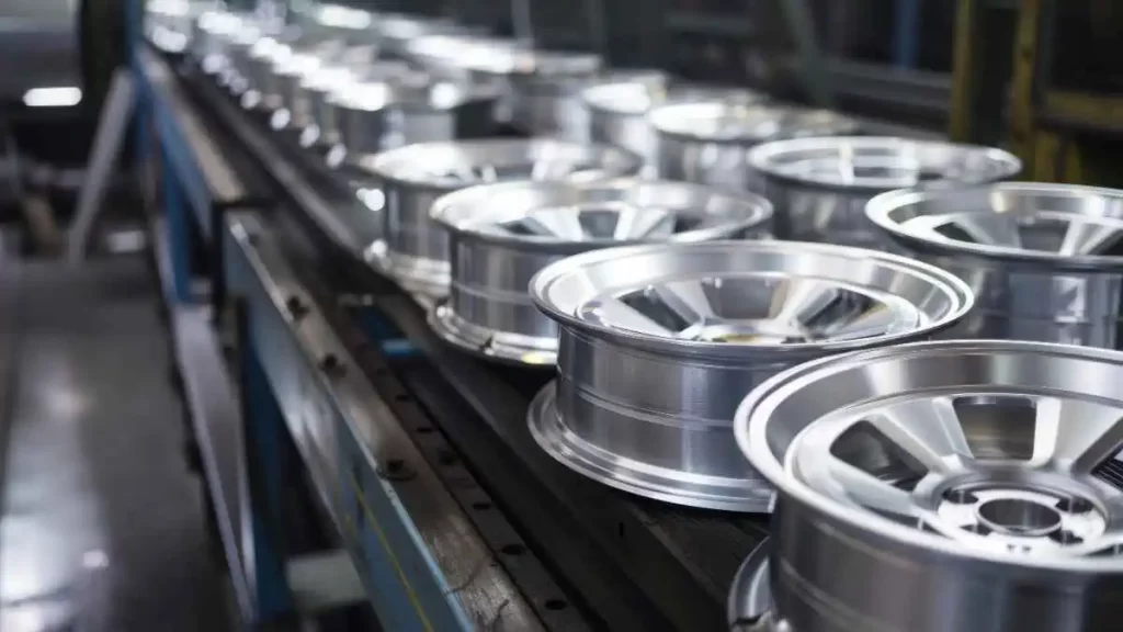 The image shows a set of machined aluminum wheels with precision and arranged neatly in order