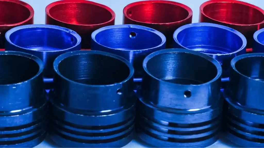 An assortment of anodized aluminum parts with vibrant finishes.