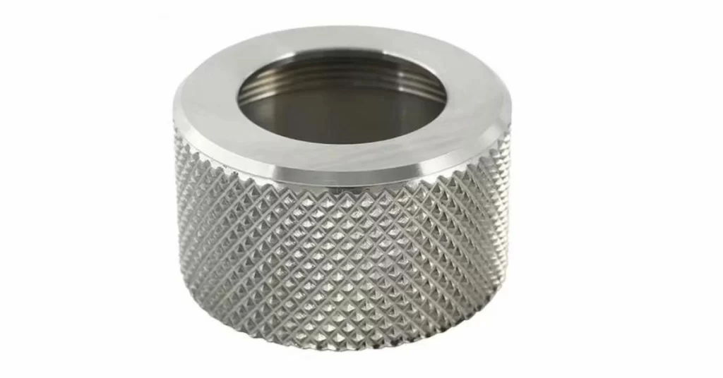 An anodized custom steel parts  large hole on center and fine knurling on the body