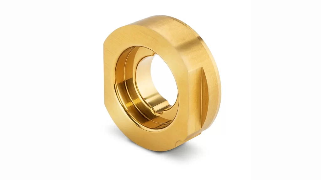 The image shows a custom PVD coated metal part with a shiny gold surface.