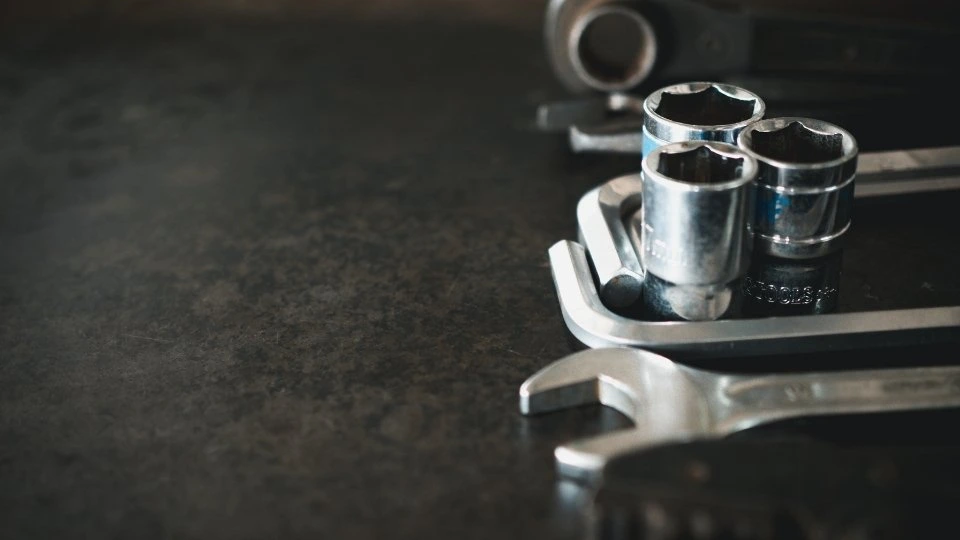 An image showing a collection of die-cast tools. The tools display a range of tool shapes, all with smooth surfaces and fine details.