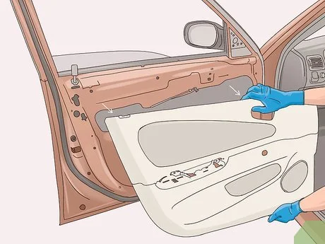 Car door panel removal and replacement process showcasing craftsmanship and attention to detail.