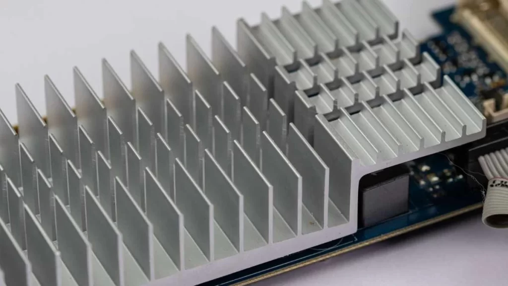 A finely machined electronic heat sink, crafted with intricate fins, and channels to dissipate heat of electronic components.