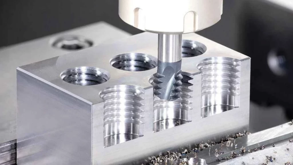 Image of the internal threading process, creating threads inside a hole in a workpiece.