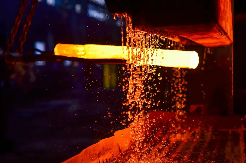 Metal quenching process following annealing, illustrating rapid cooling for enhanced material properties and structural integrity.