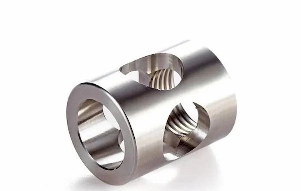 A custom stainless steel parts with two holes on body and internal threads on the end 