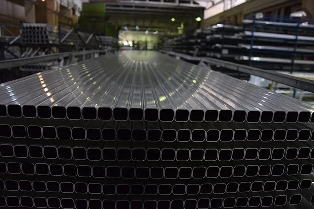 Numerous aluminum rectangular tubes in a warehouse