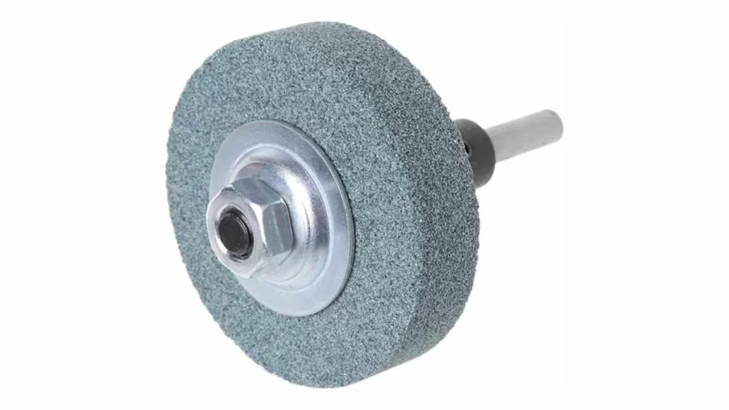 An image of an abrasive grinding wheel. It showcases a simple depiction of the wheel, highlighting its rough texture and cutting surface