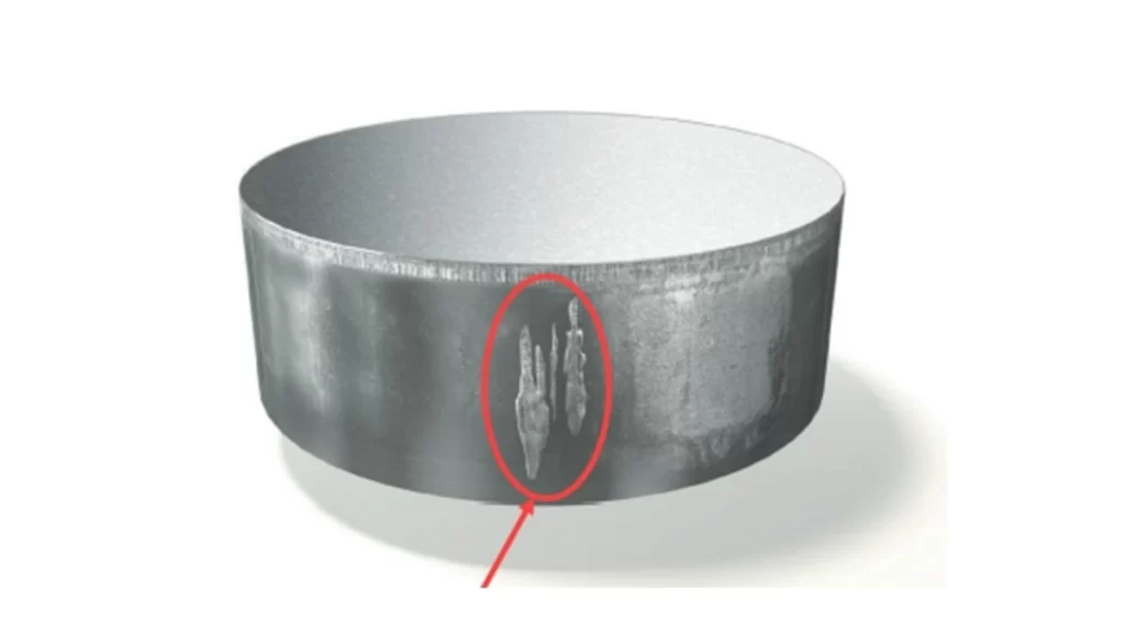 The highlighted section shows galling on an aluminum part surface