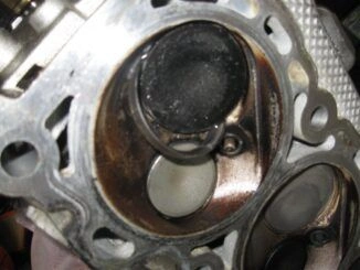 Close-up of a burnt valve section showing discoloration and damage