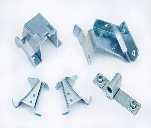 An image with various complex metal stamped parts, emphasizing the the capability of the process. 