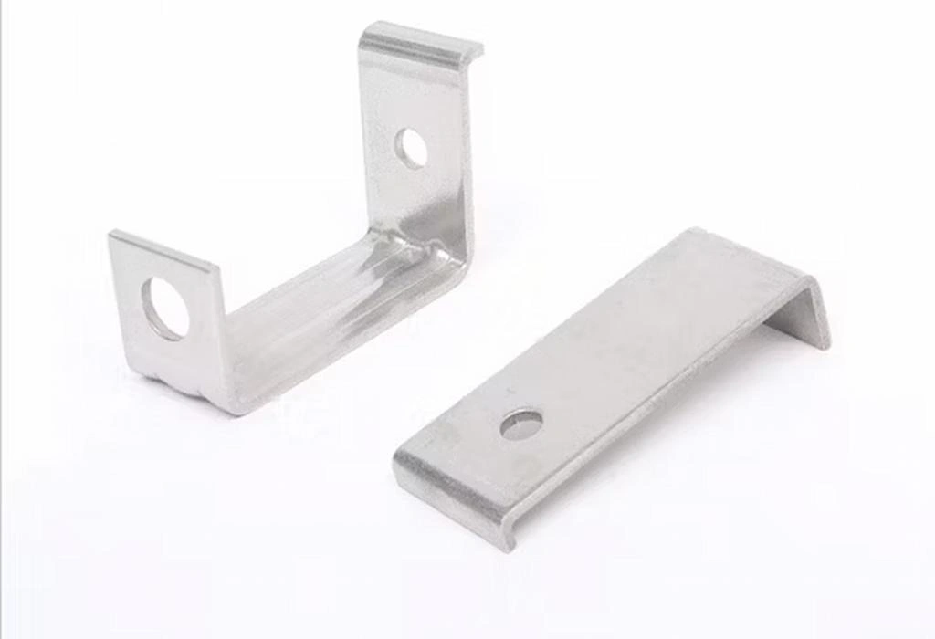 Two U-shaped custom stainless steel brackets made with stamping