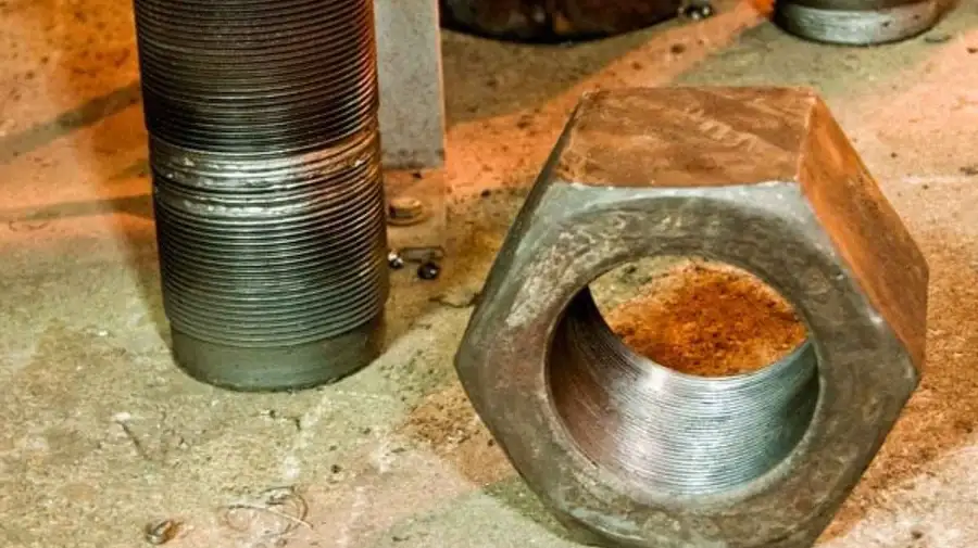 A close-up view of galling on a fastener, and bolt. It highlights the damaged area