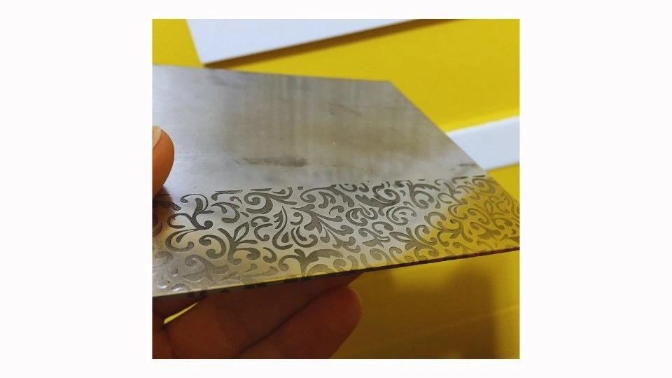 An overview of a fiber sheet with highly detailed laser engraving. It showcases intricate and precise markings on the surface.