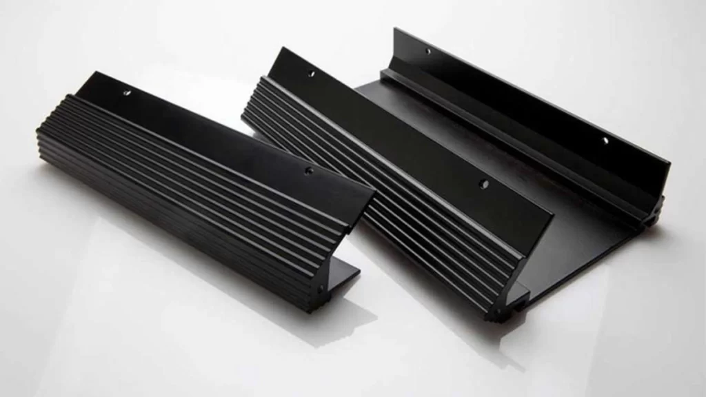 An image of finished extruded aluminum profiles with a polished black surface. The profiles showcase a sleek and high-quality finish