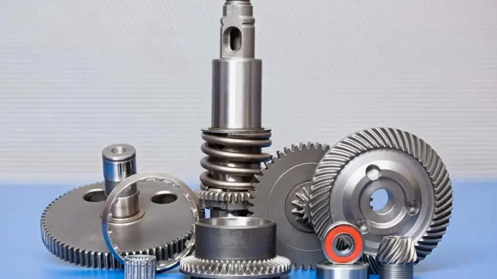 An image showing heavy-duty machined gear, and shaft parts displayed together