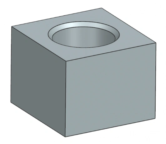 An image of a chamfered hole in a block of material 