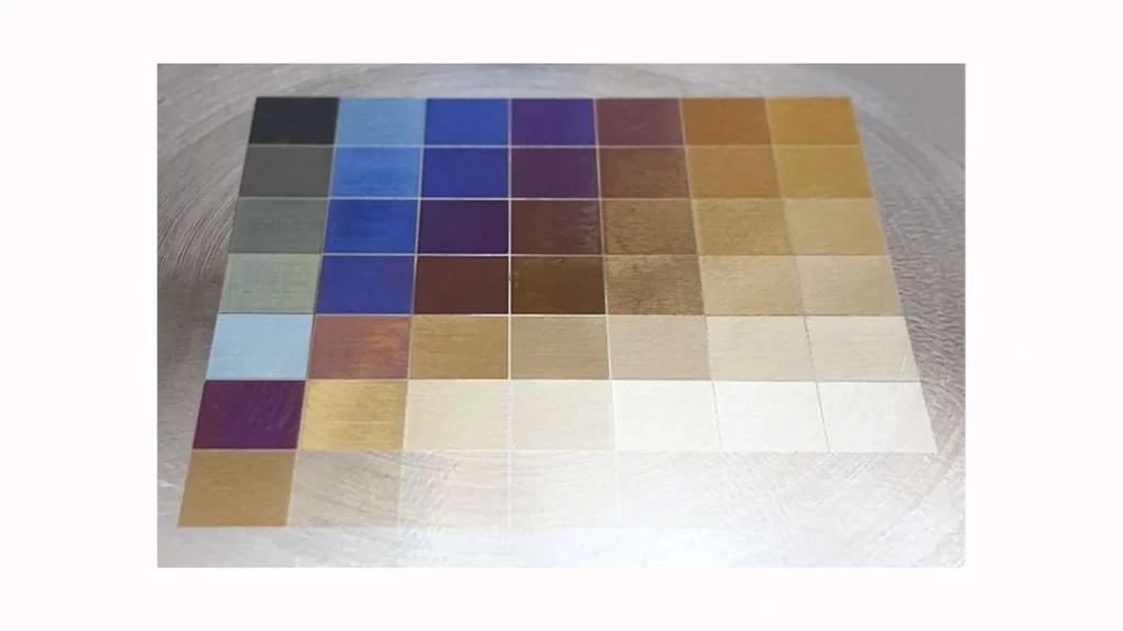 The image displays a laser-marked surface with distinct shades created.