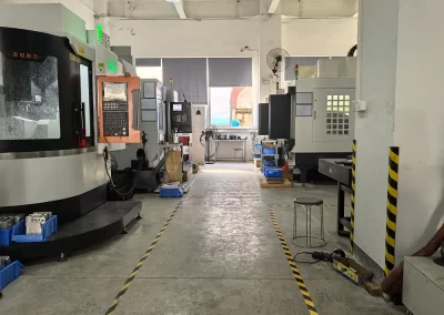 The image showcases Proleantech's CNC machining workshop, featuring four CNC machining centers in the picture.