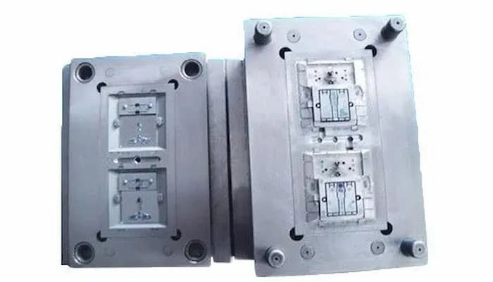 An image showing two halves of the electrical switch mold, cavity & core. 