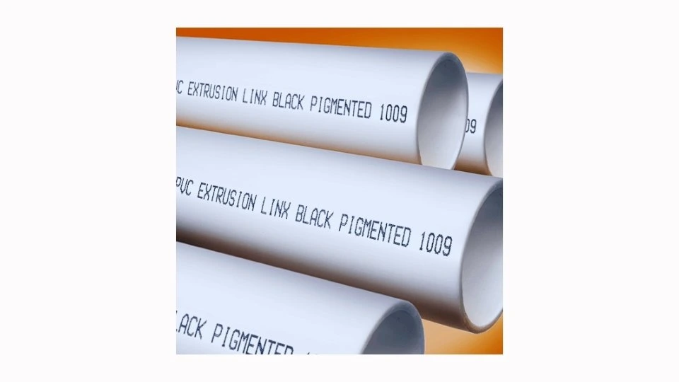 A plastic pipe with laser markings displaying clear, high-contrast text. 