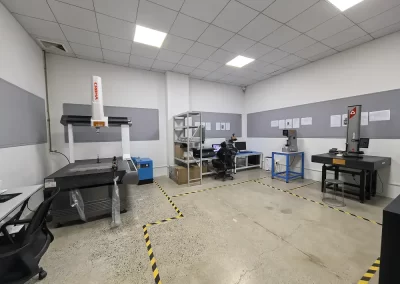 The image depicts the Quality Inspection Room, equipped with climate-controlled air conditioning and various quality inspection equipment, such as CMM (Coordinate Measuring Machine), vision measuring systems, spectrometers, and more